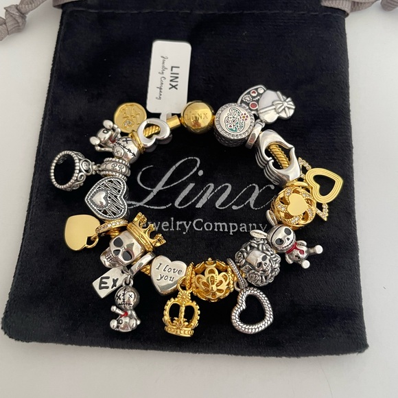 Linx Yellow Gold Bracelet with Gold and Silver Skull Themed Charms